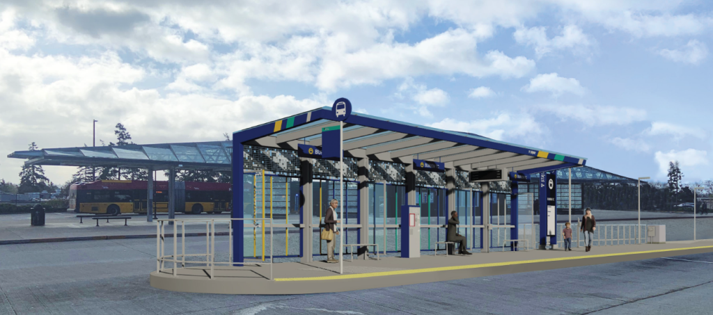 People standing and sitting at a covered bus shelter on a raised platform.